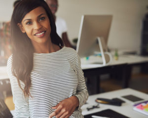 woman smiling at a trendy office