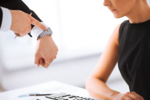 an employer harassing a female employee with time and a fancy watch