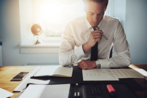 a discrimination lawyer looking over a client's paperwork