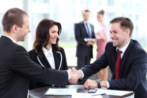 employment lawyers speaking and shaking hands with a client