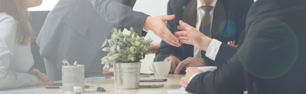 a business group shaking hands in the office