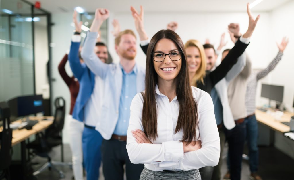 worker's rights exemplified by many employees with their hands up in joy