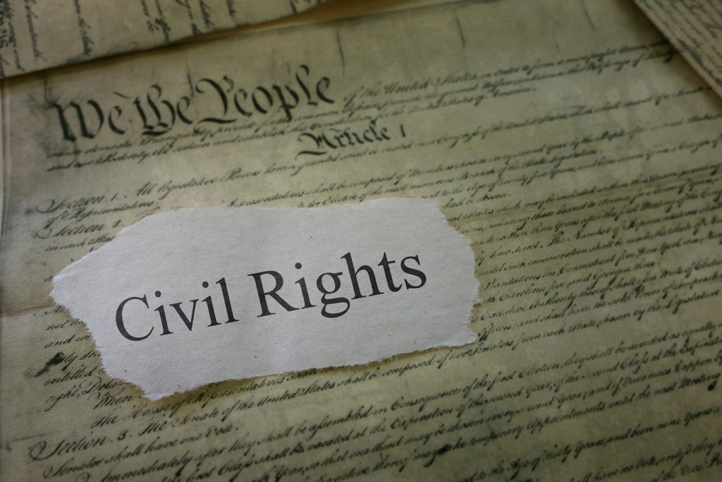 Civil Rights newspaper headline on a copy of the US Constitution